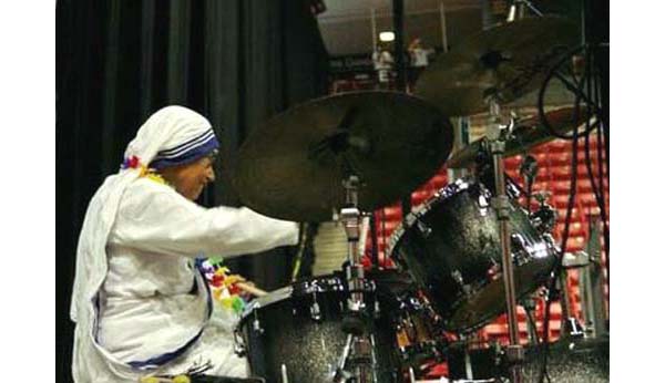 Missionaries of Charity sister playing the drums